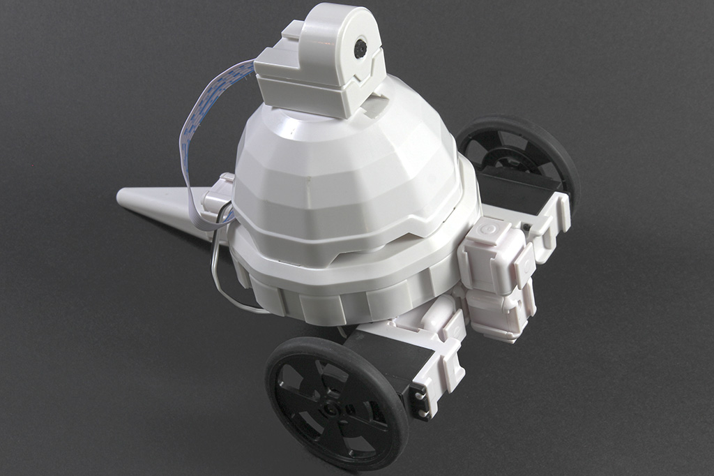 The EZ-Robot AdventureBot, a two-wheeled robot with a twelve-sided body and a camera on top