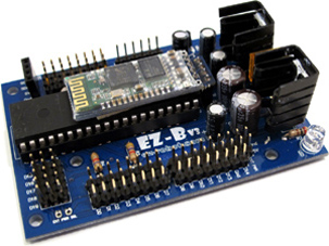 The EZ-B v3: a blue circuit board with a Bluetooth module, a microcontroller, rows of pin headers and two voltage regulators with heat sinks